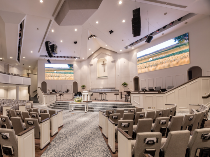 Emmanuel Baptist Church auditorium featuring OHR LED screens and NEXO sound system installed by AVDOXA